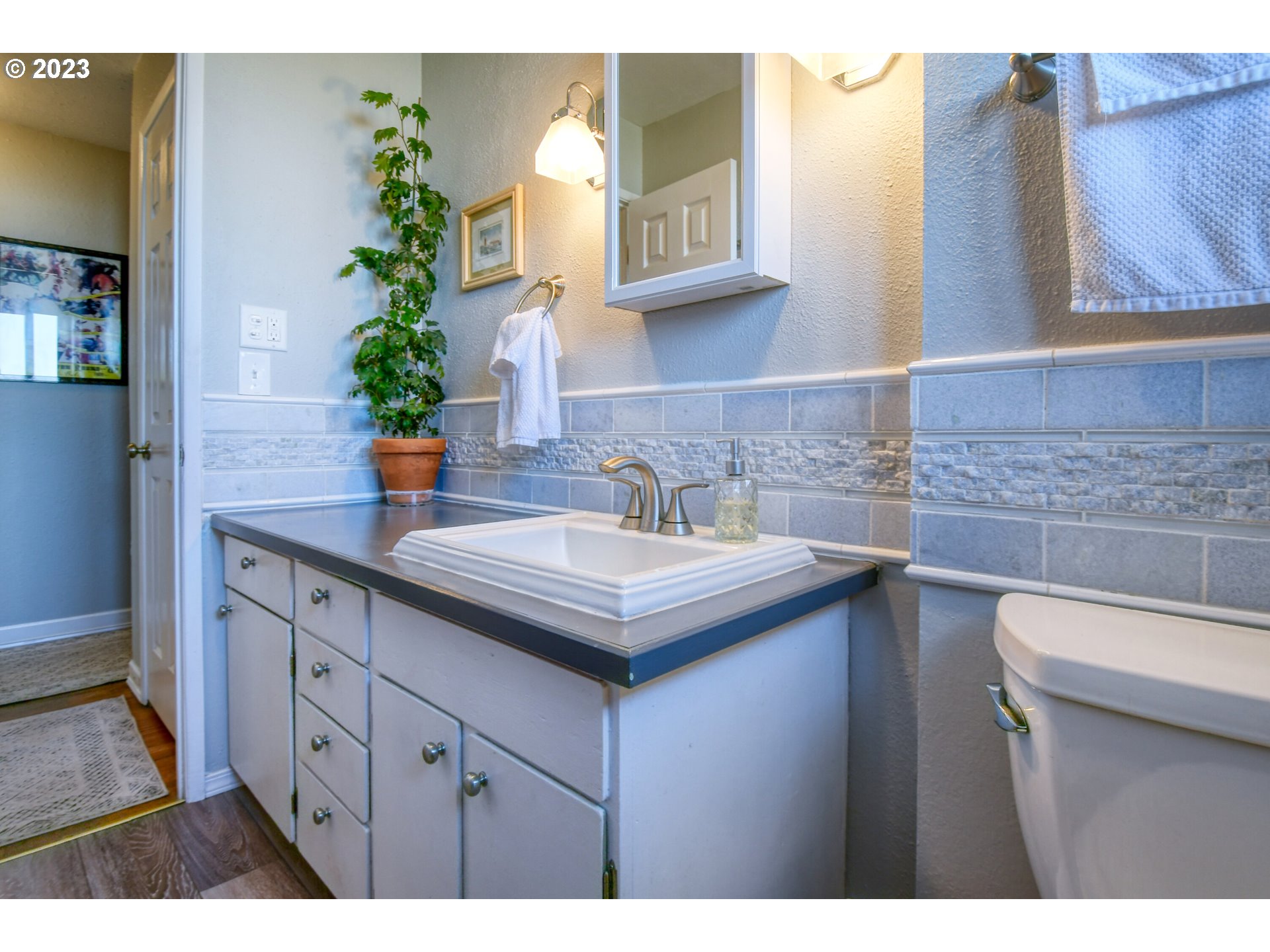 2437 Southwest Ladow Avenue Pendleton, OR 97801 - Photo 15 of 32 a kitchen with a sink and cabinets