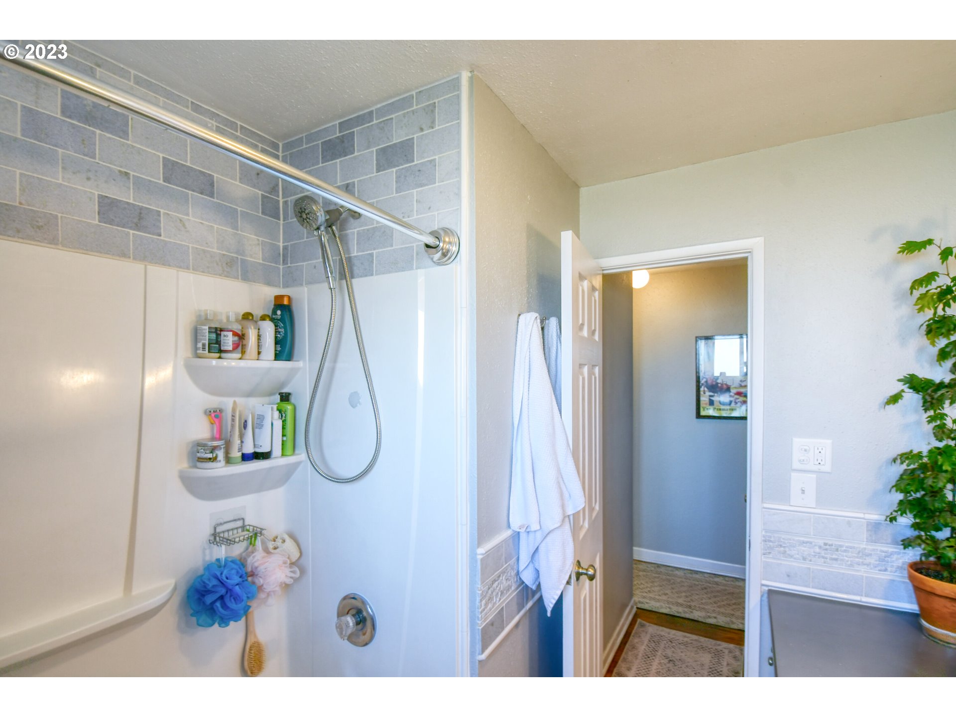 2437 Southwest Ladow Avenue Pendleton, OR 97801 - Photo 17 of 32 a picture of a living room and bathroom