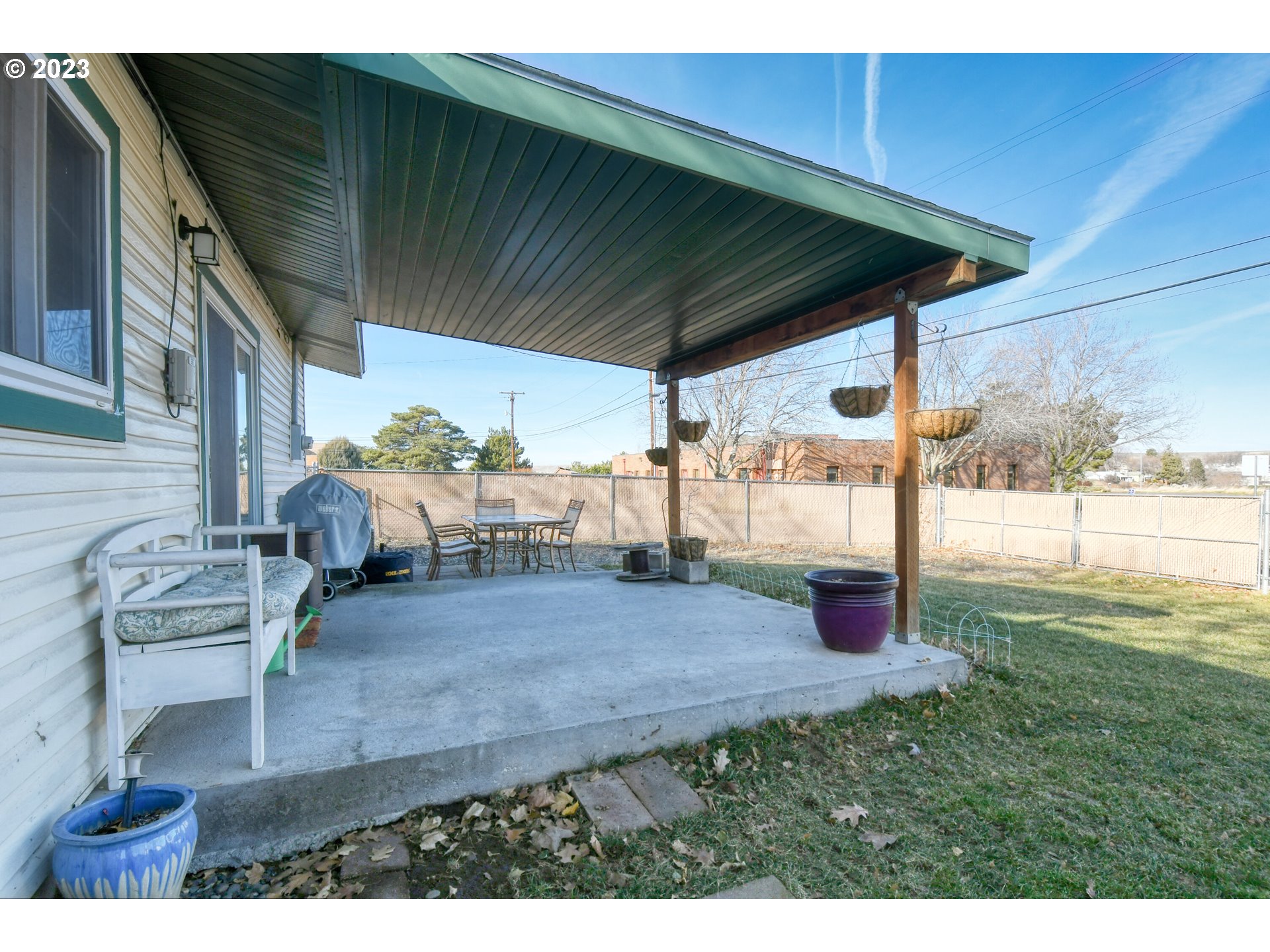 2437 Southwest Ladow Avenue Pendleton, OR 97801 - Photo 26 of 32 a backyard of a house with table and chairs