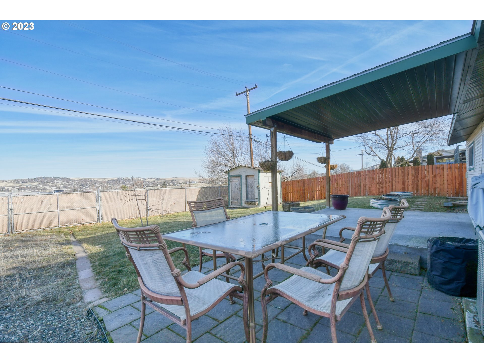 2437 Southwest Ladow Avenue Pendleton, OR 97801 - Photo 28 of 32 a view of a patio with table and chairs and potted plants