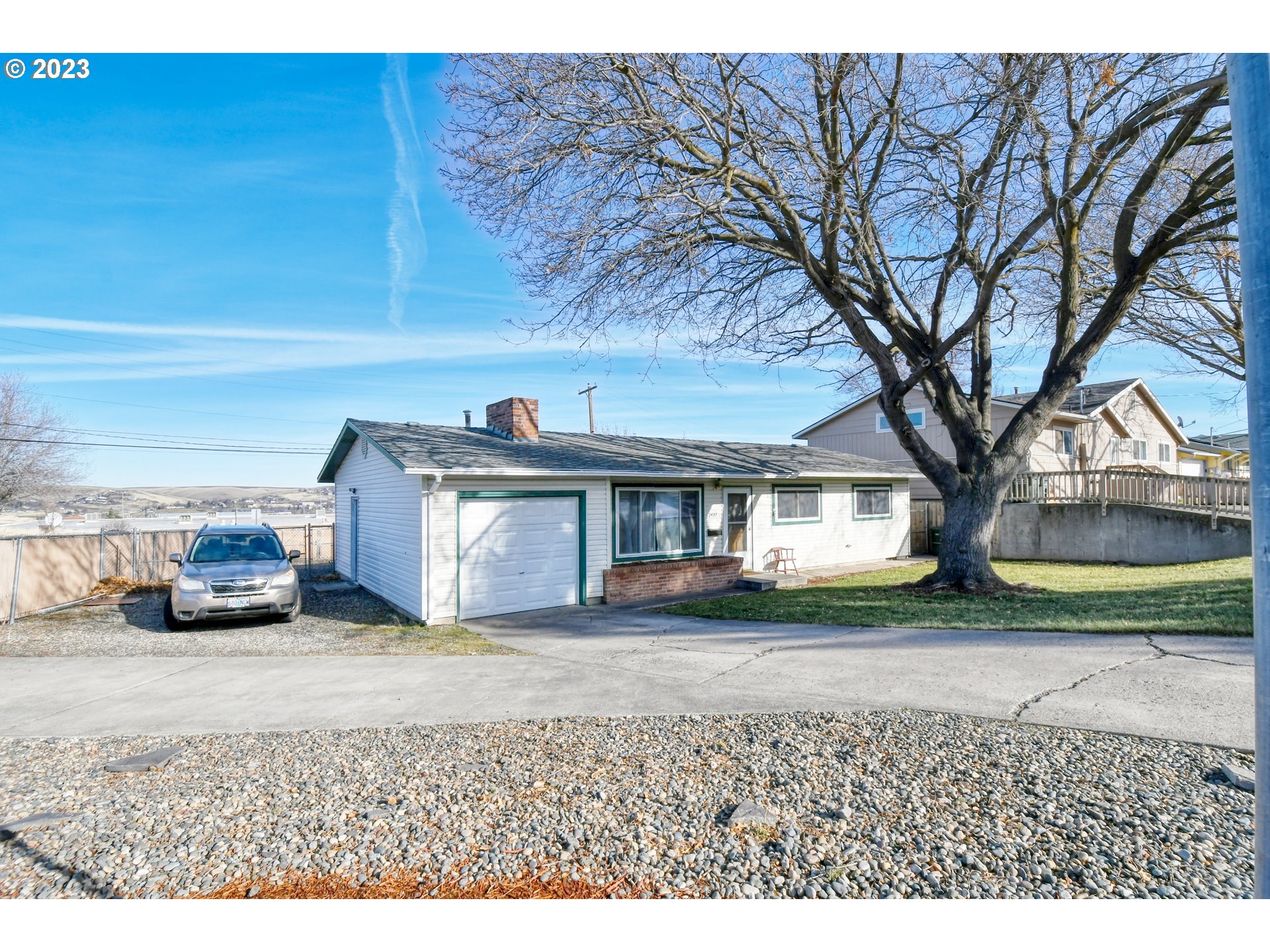 2437 Southwest Ladow Avenue Pendleton, OR 97801 - Photo 3 of 32 a view of a house with a yard