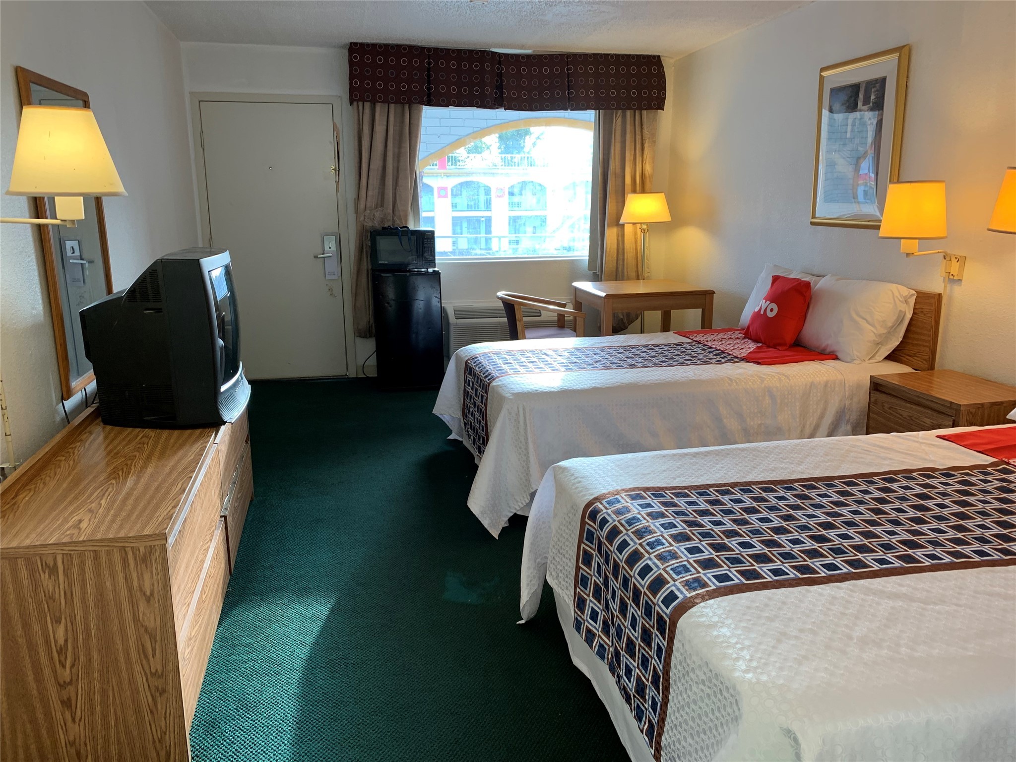 a bedroom with a bed and a lamp