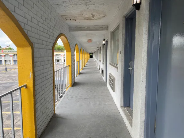 a view of a hallway view with staircase