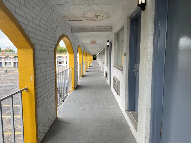 a view of a hallway view with staircase