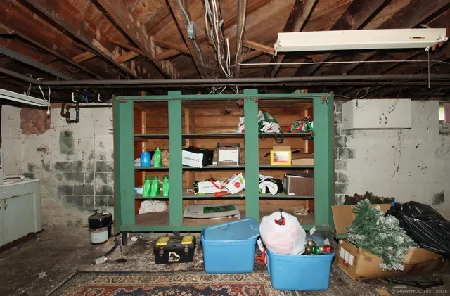 a utility room with cabinets dryer and washer