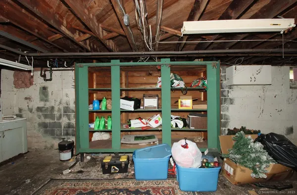 a utility room with cabinets dryer and washer