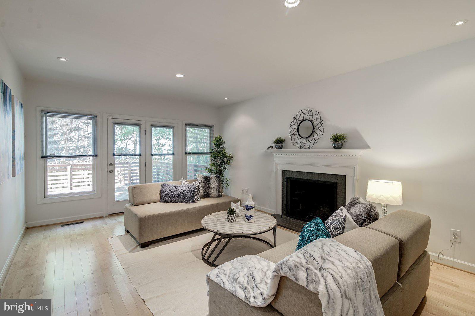 2064 Madrillon Road Vienna, VA 22182 - Photo 41 of 68 Family room with a fireplace