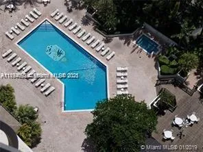 a kitchen with lots of counter top space and wooden floor