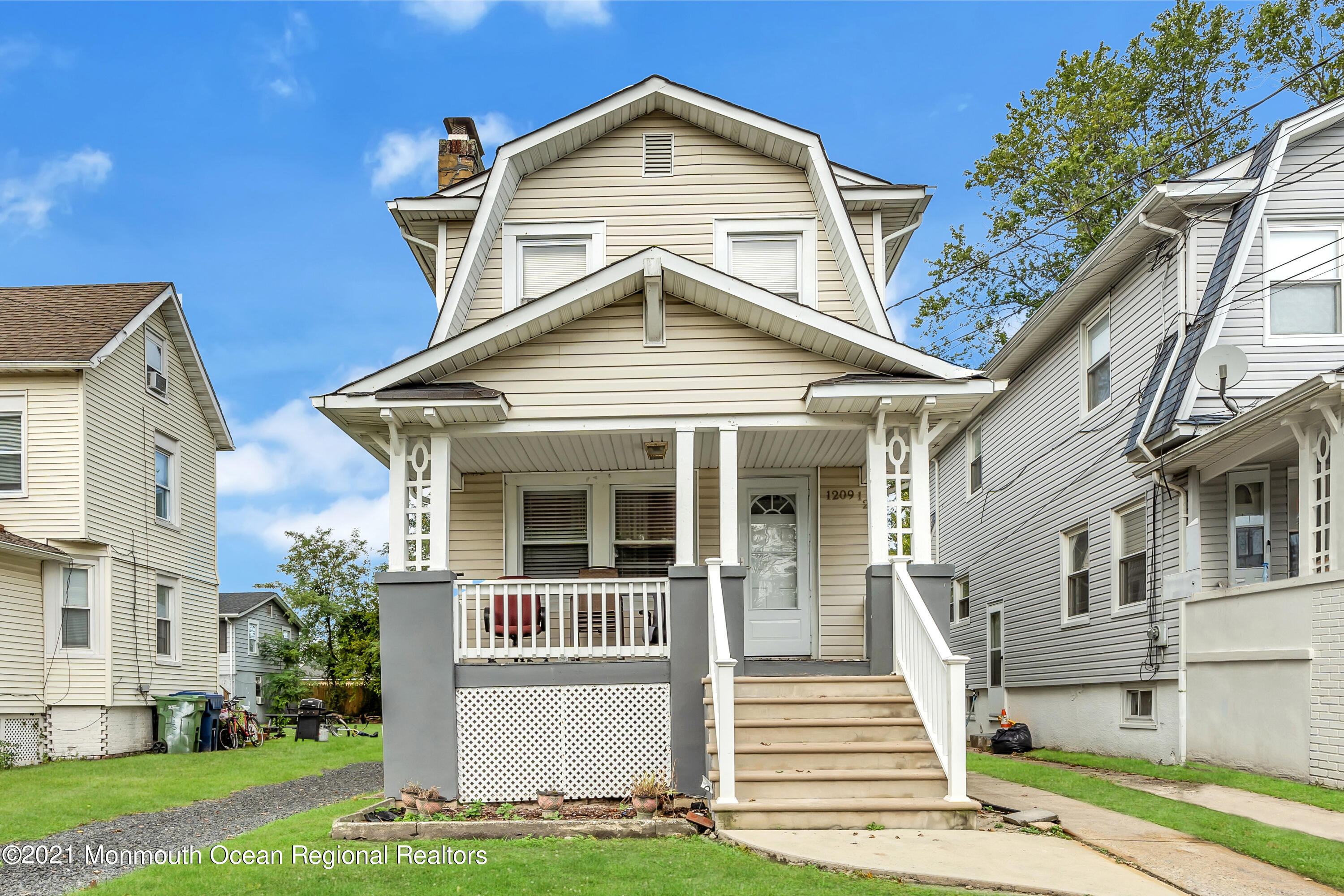 1209 7th Avenue, Unit 1/2 Neptune Township, NJ 07753 - Photo 1 of 19 a front view of a house with a yard