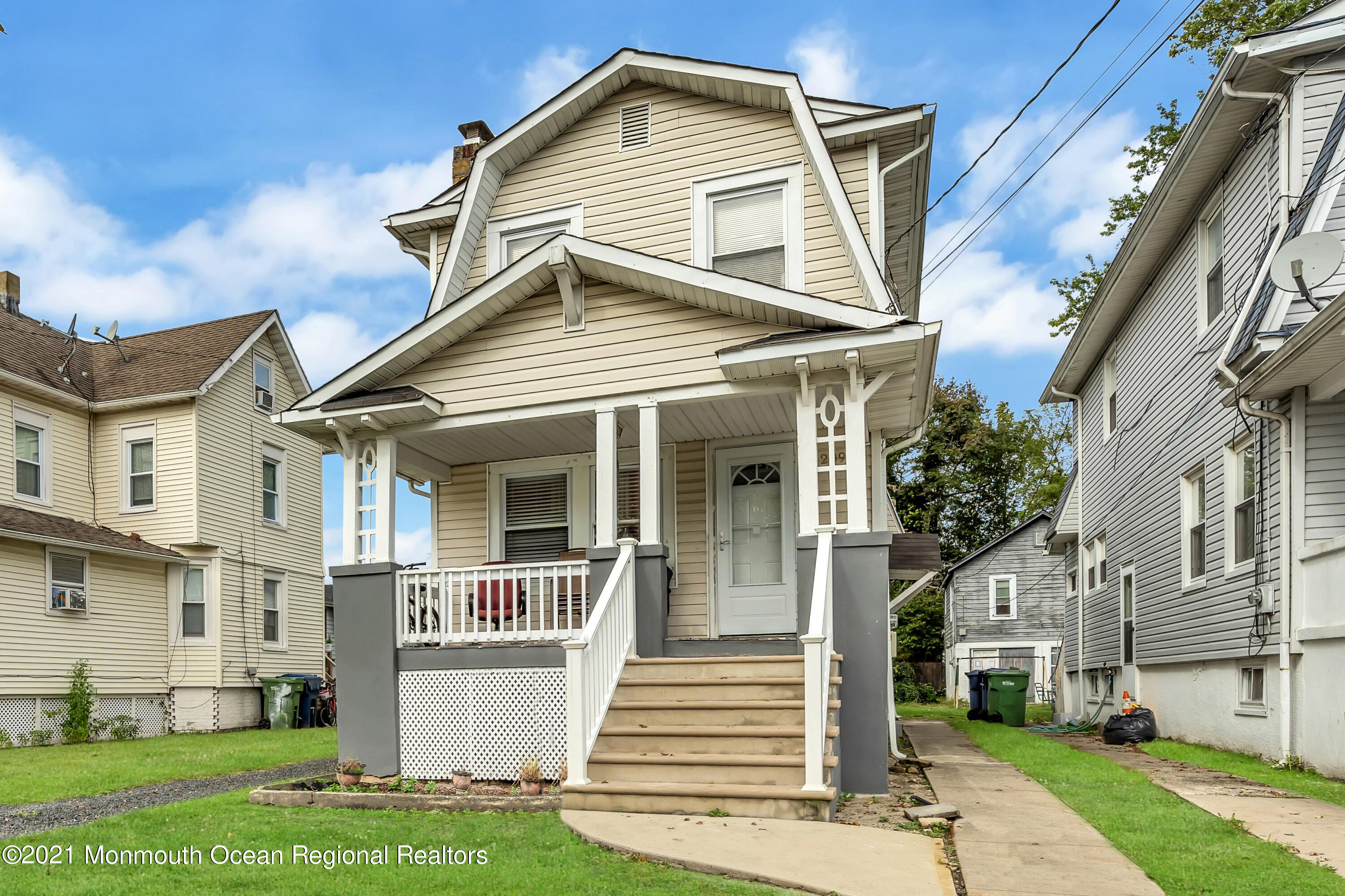 1209 7th Avenue, Unit 1/2 Neptune Township, NJ 07753 - Photo 13 of 19 a front view of a house with a yard