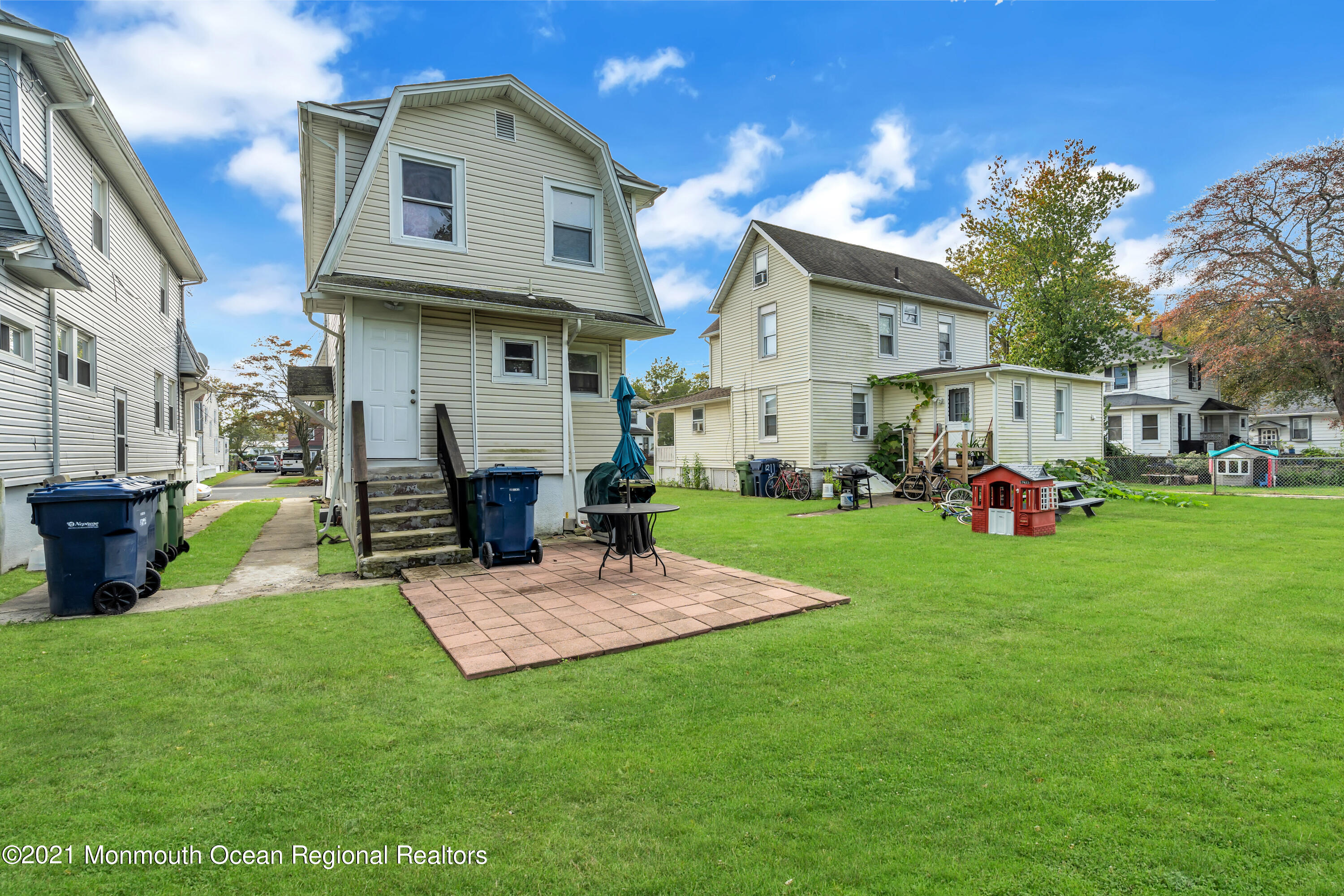 1209 7th Avenue, Unit 1/2 Neptune Township, NJ 07753 - Photo 16 of 19 a view of a house with a yard and sitting area