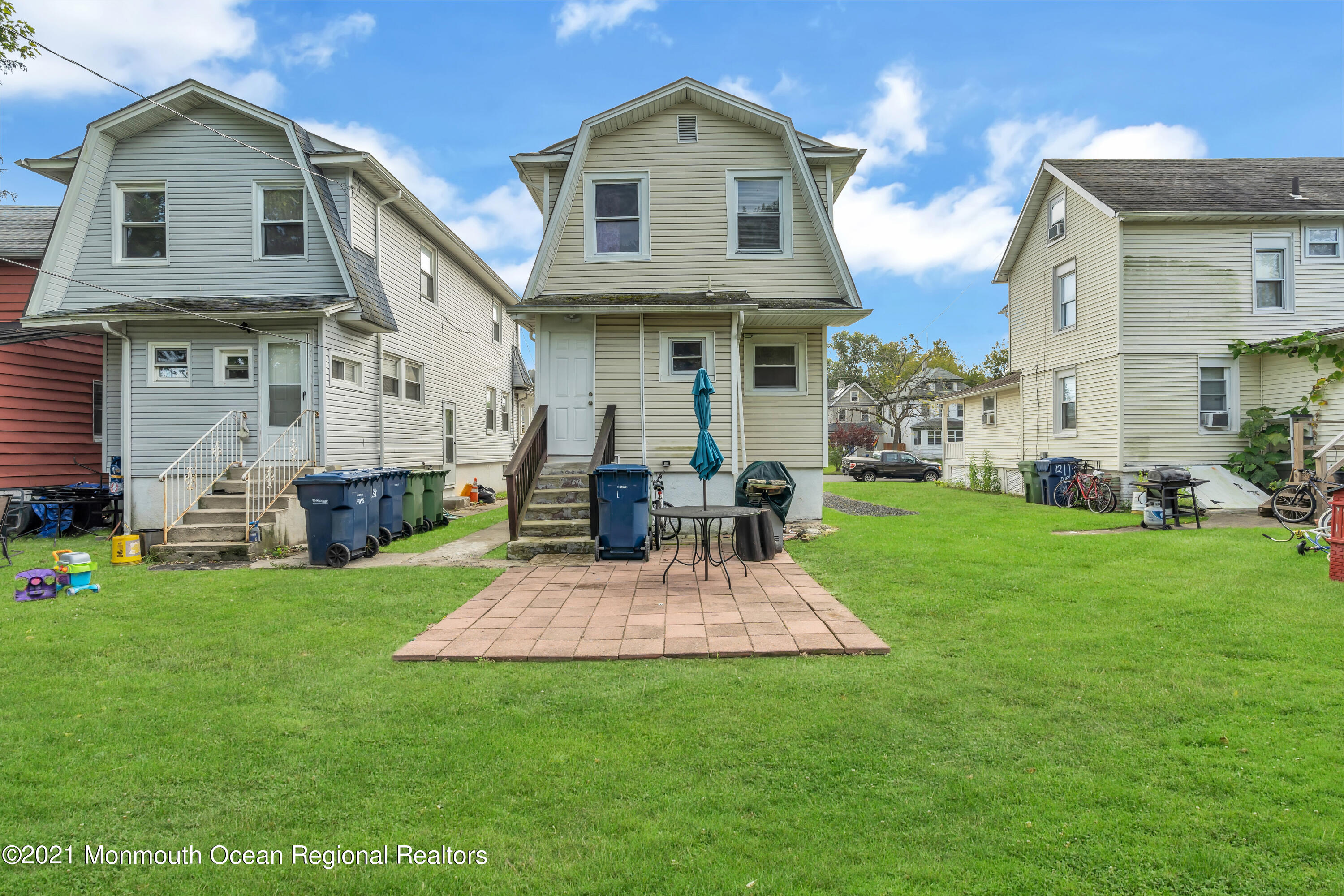 1209 7th Avenue, Unit 1/2 Neptune Township, NJ 07753 - Photo 17 of 19 a view of a house with a yard and sitting area