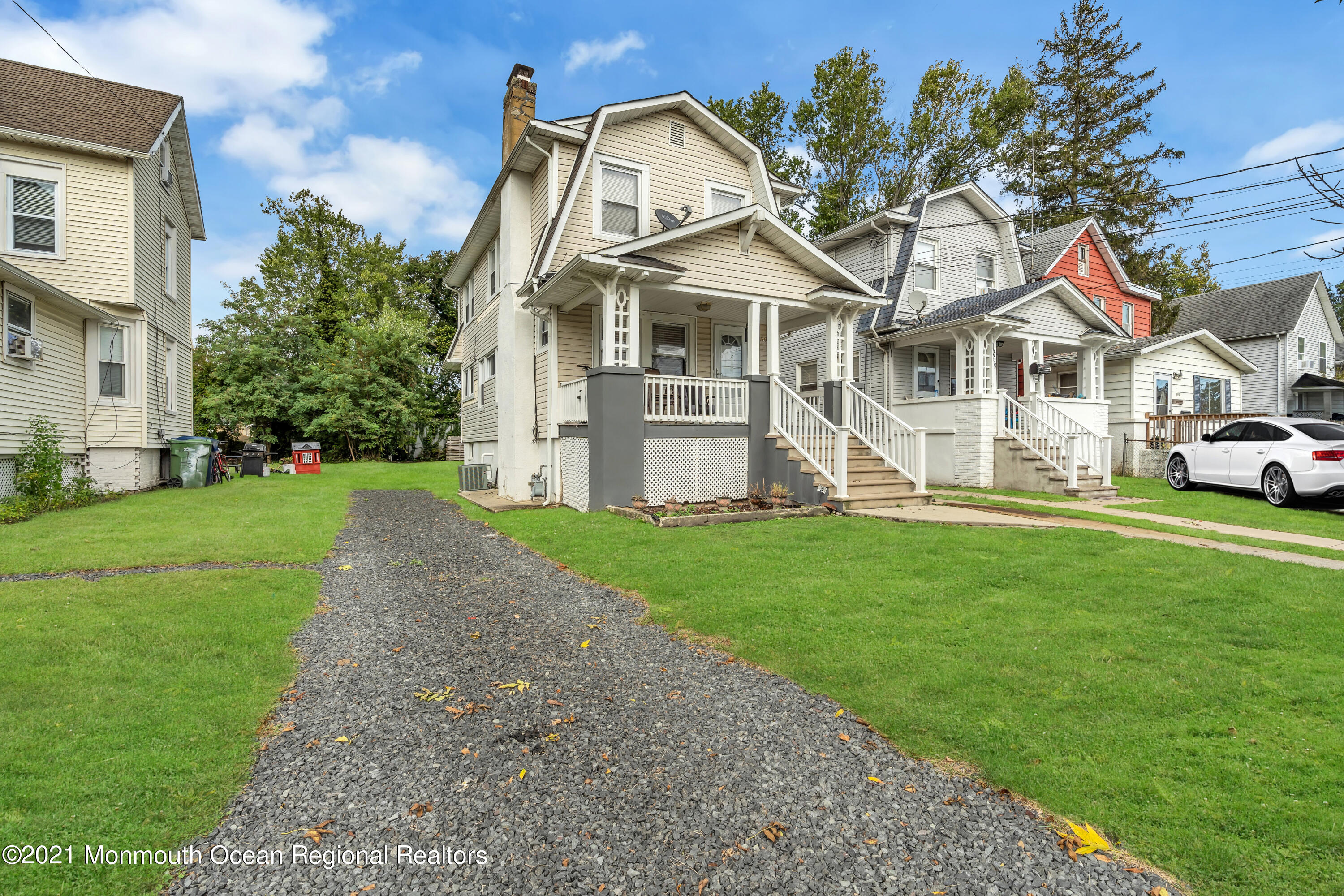 1209 7th Avenue, Unit 1/2 Neptune Township, NJ 07753 - Photo 18 of 19 a front view of a house with a garden