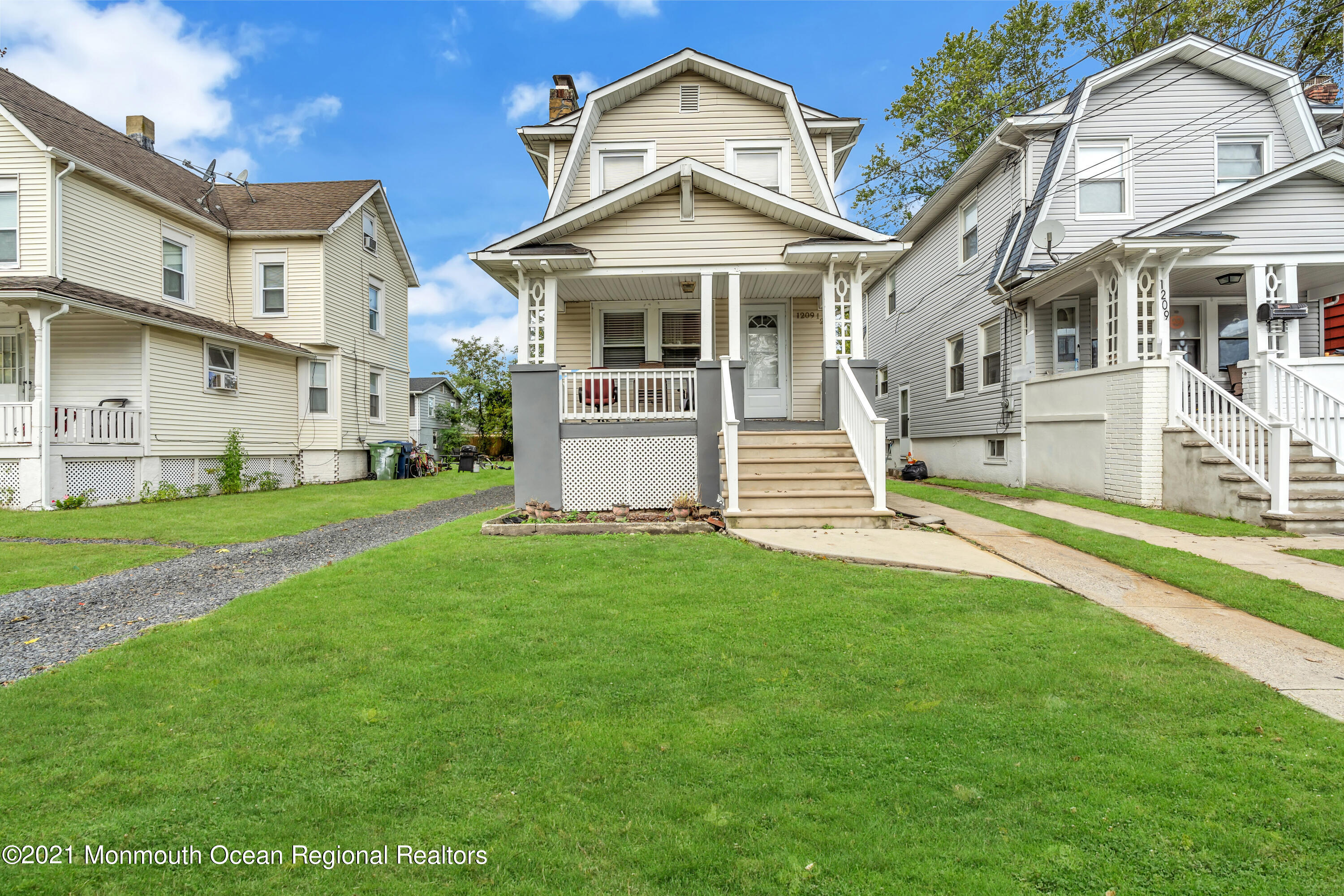 1209 7th Avenue, Unit 1/2 Neptune Township, NJ 07753 - Photo 19 of 19 a front view of a house with a yard