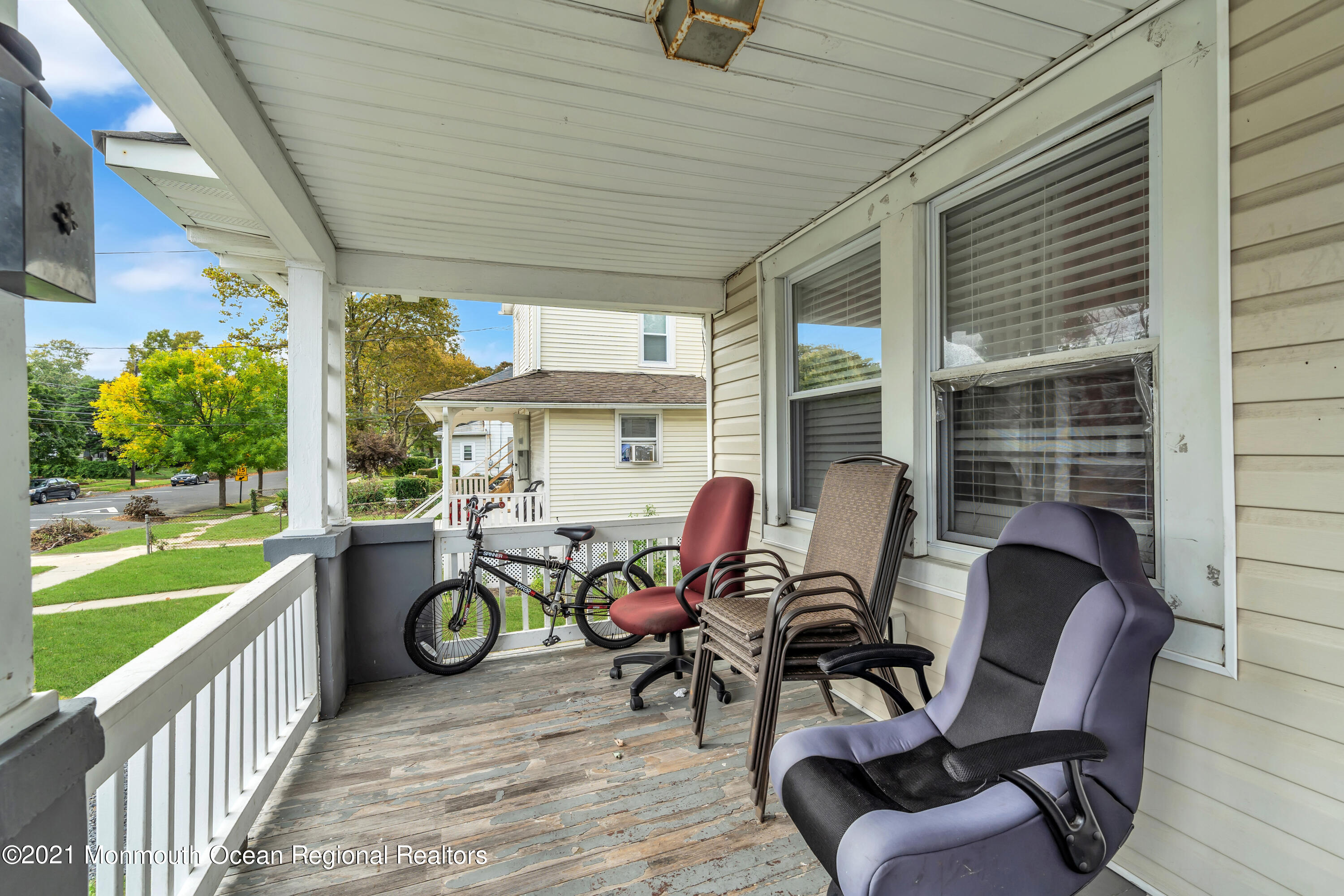 1209 7th Avenue, Unit 1/2 Neptune Township, NJ 07753 - Photo 4 of 19 a view of a chairs and table in patio with a fire pit