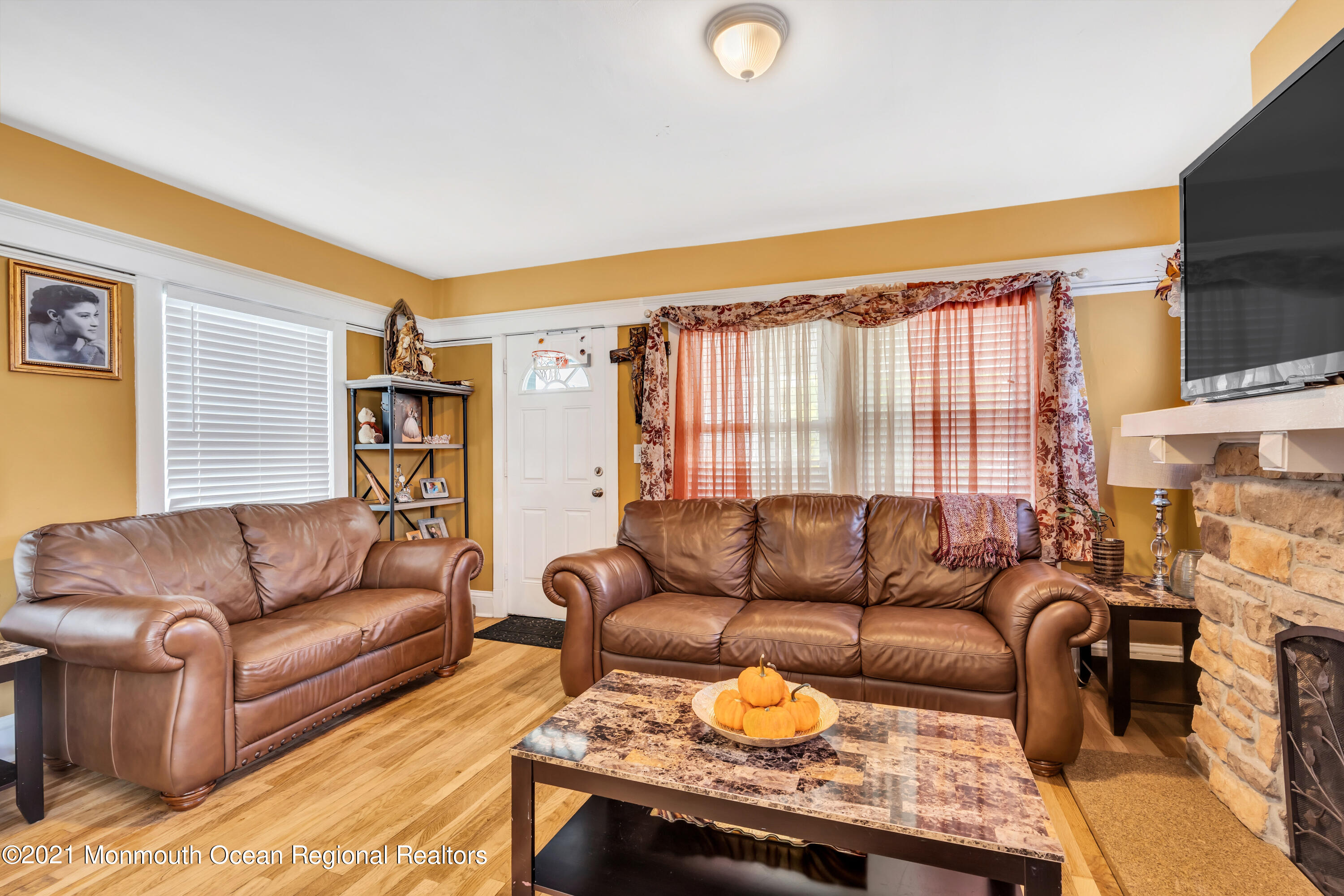 1209 7th Avenue, Unit 1/2 Neptune Township, NJ 07753 - Photo 6 of 19 a living room with furniture and a large window