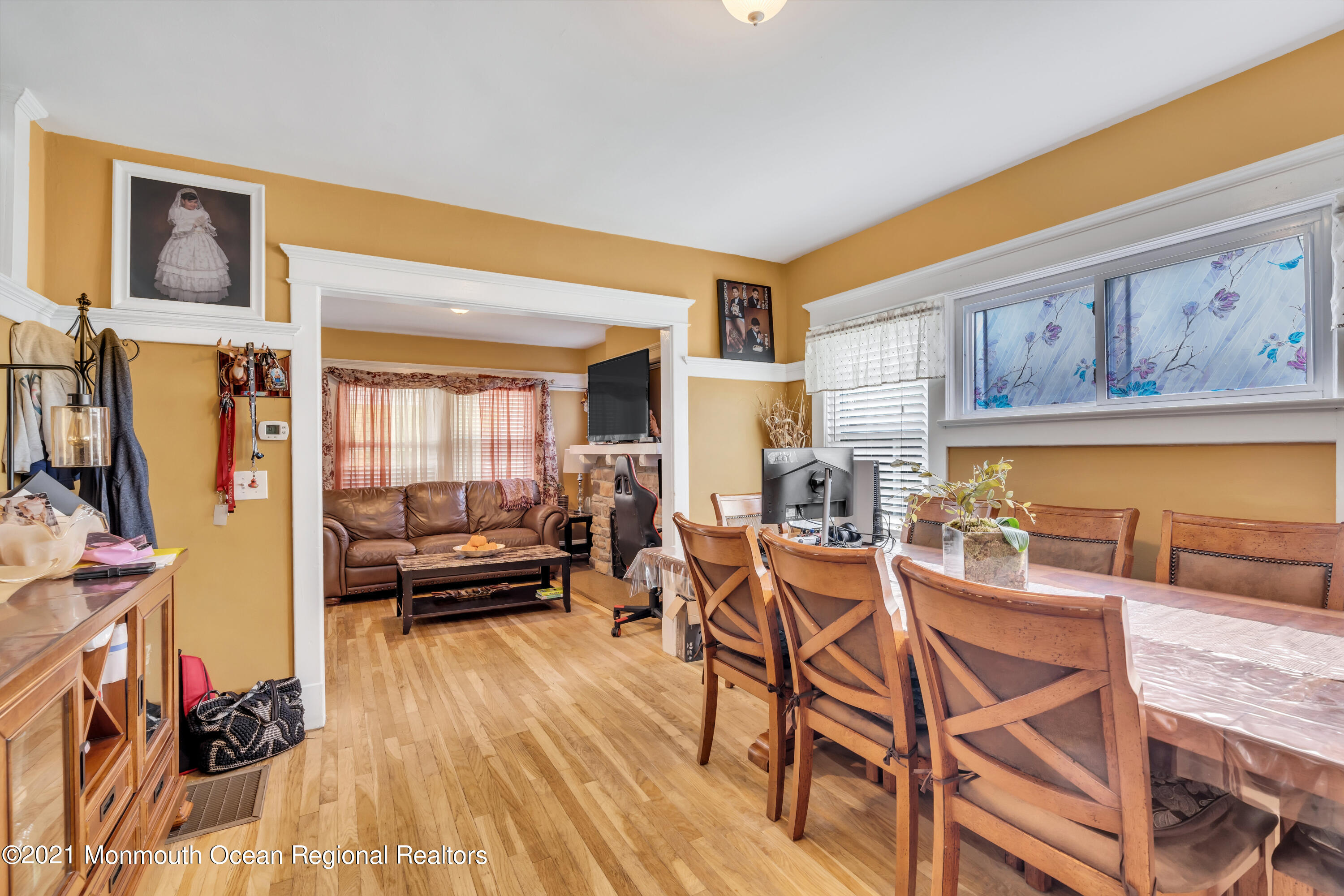1209 7th Avenue, Unit 1/2 Neptune Township, NJ 07753 - Photo 9 of 19 a dining room with furniture and wooden floor