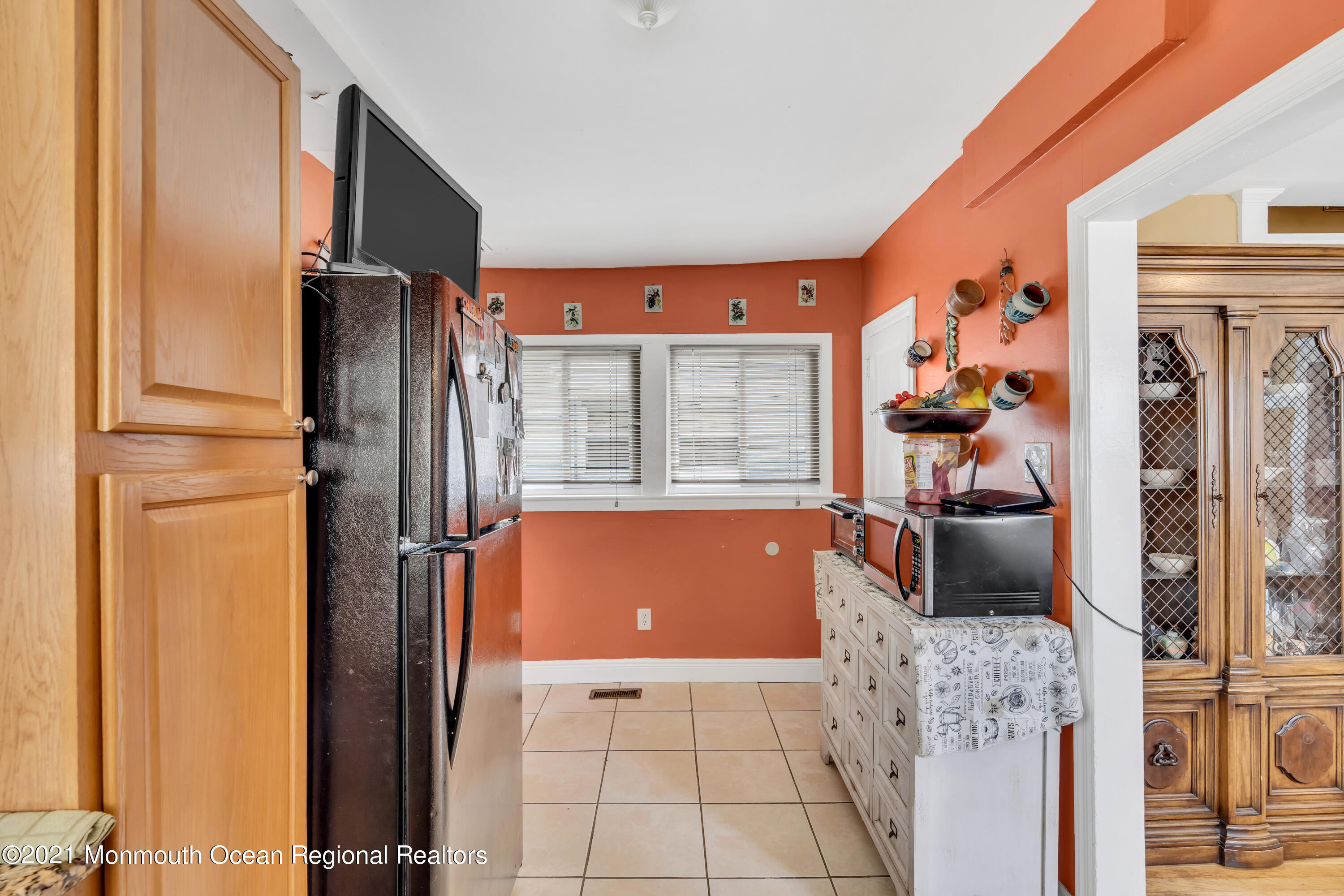 1209 7th Avenue, Unit 1/2 Neptune Township, NJ 07753 - Photo 10 of 19 a view of kitchen with furniture and large window