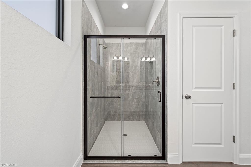 2617 3rd Street Southwest Lehigh Acres, FL 33976 - Photo 14 of 22 a bathroom with a shower