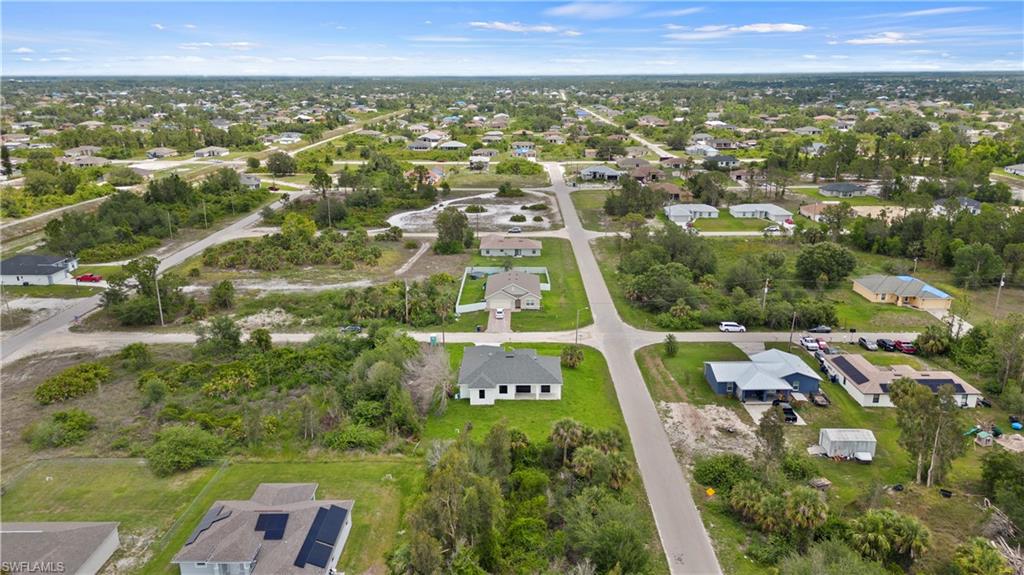 2617 3rd Street Southwest Lehigh Acres, FL 33976 - Photo 22 of 22 an aerial view of residential houses with outdoor space