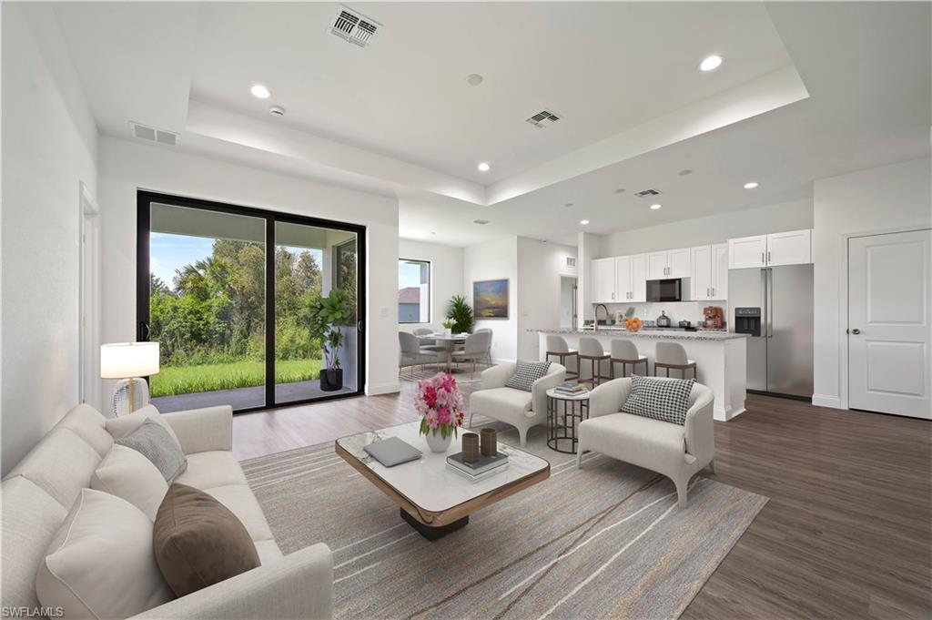2617 3rd Street Southwest Lehigh Acres, FL 33976 - Photo 7 of 22 a living room with furniture and a large window