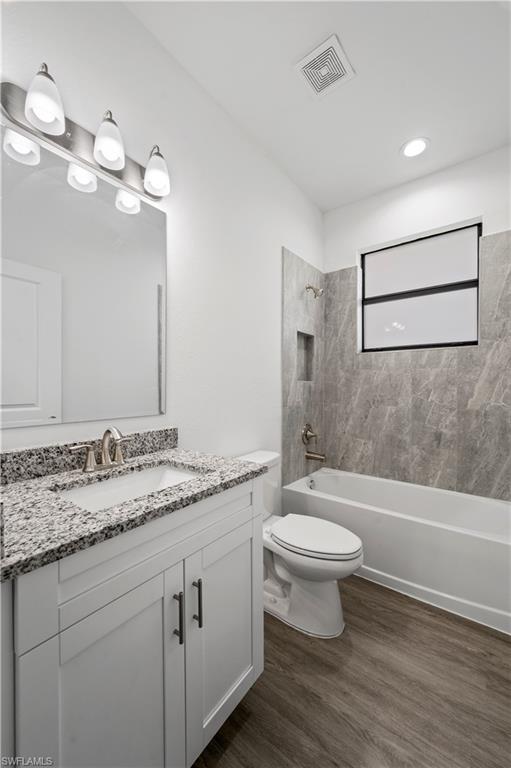 2617 3rd Street Southwest Lehigh Acres, FL 33976 - Photo 10 of 22 a bathroom with a sink a toilet and shower