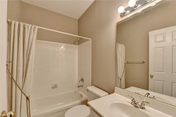 a bathroom with a bathtub and a sink