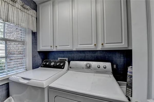 a kitchen with a cabinets and appliances