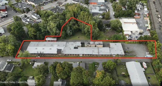 an aerial view of a house with outdoor space