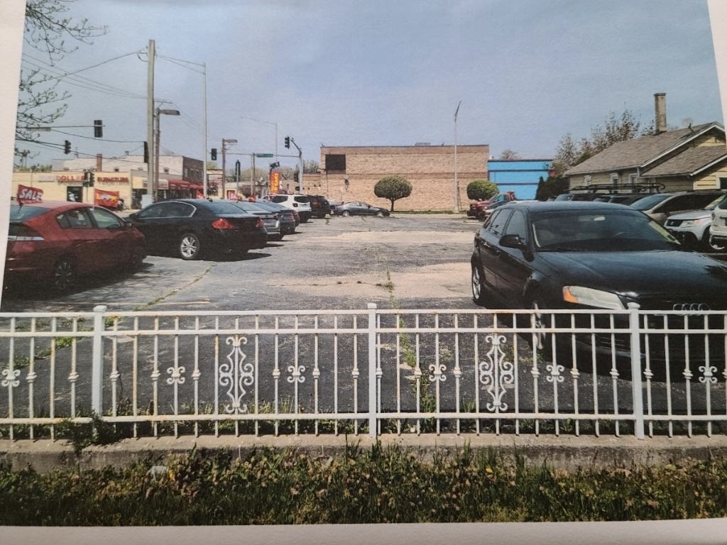 a view of a balcony with car parked
