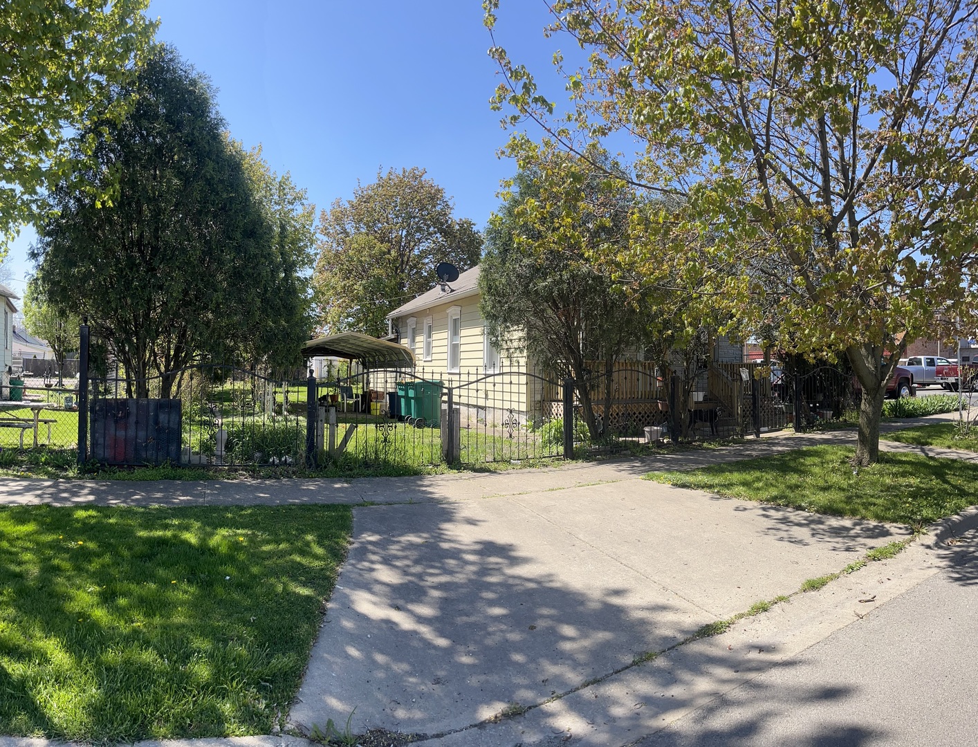 624 Collins Street Joliet, IL 60432 - Photo 3 of 5 a front view of a house with a yard and outdoor seating