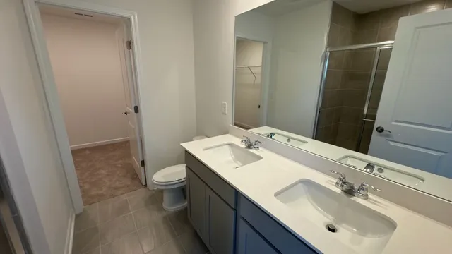 a bathroom with a sink toilet tub and shower