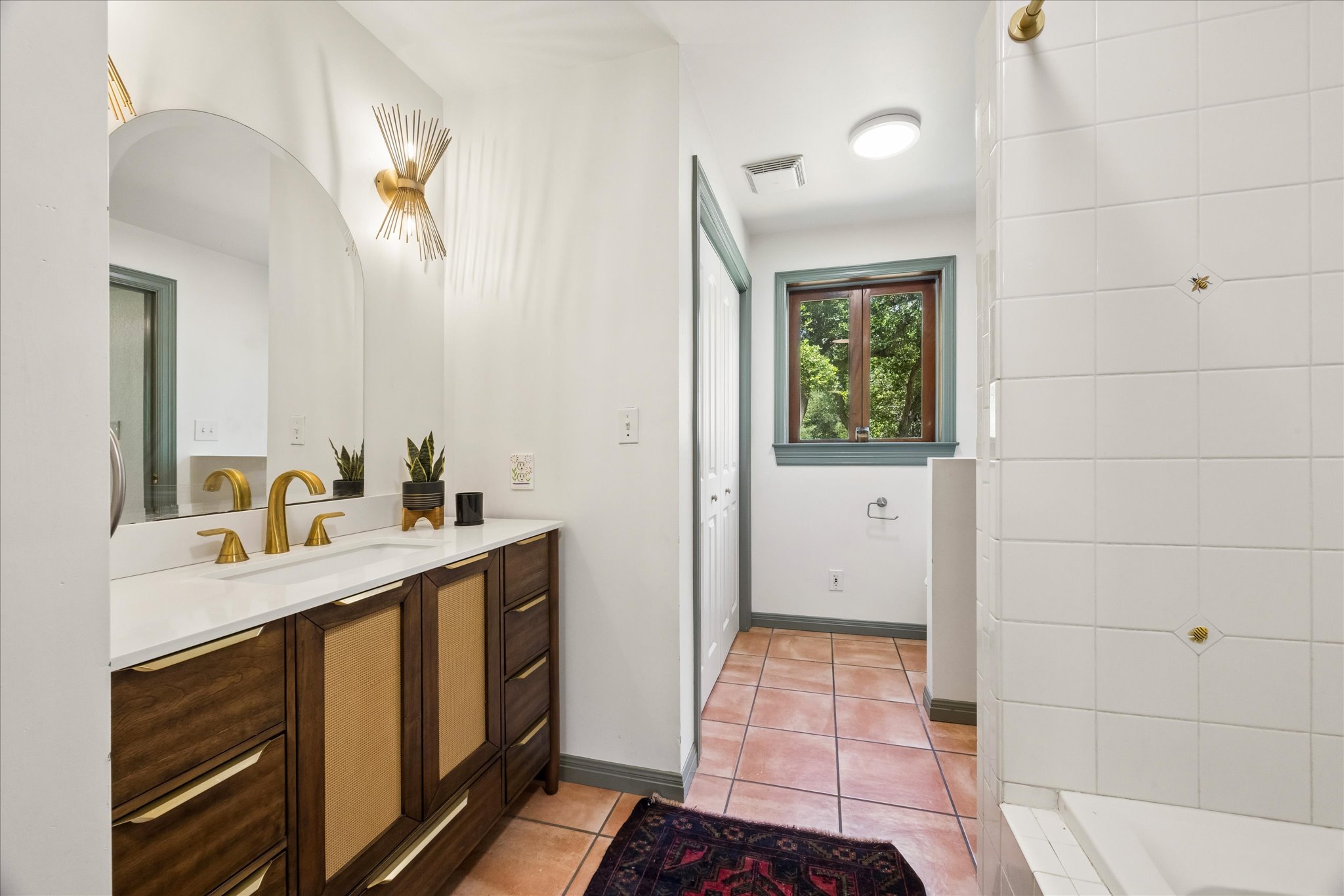 700 South Rainbow Ranch Road Wimberley, TX 78676 - Photo 16 of 29 he ensuite bath blends comfort and function with timeless finishes,