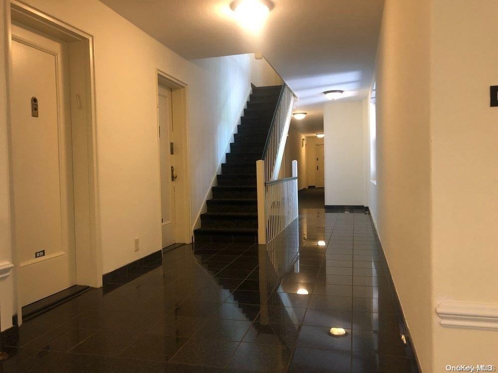 15 Canterbury Road, Unit C13 Great Neck, NY 11021 - Photo 12 of 12 a view of entryway and hall with wooden floor