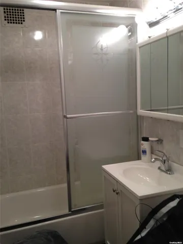 a bathroom with a sink and mirror