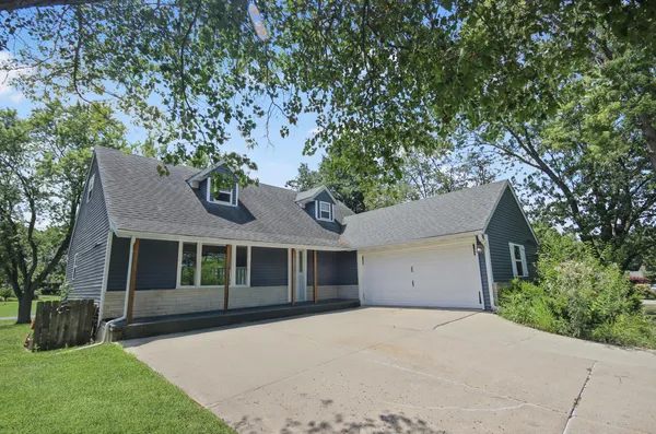a house with a tree in front of it