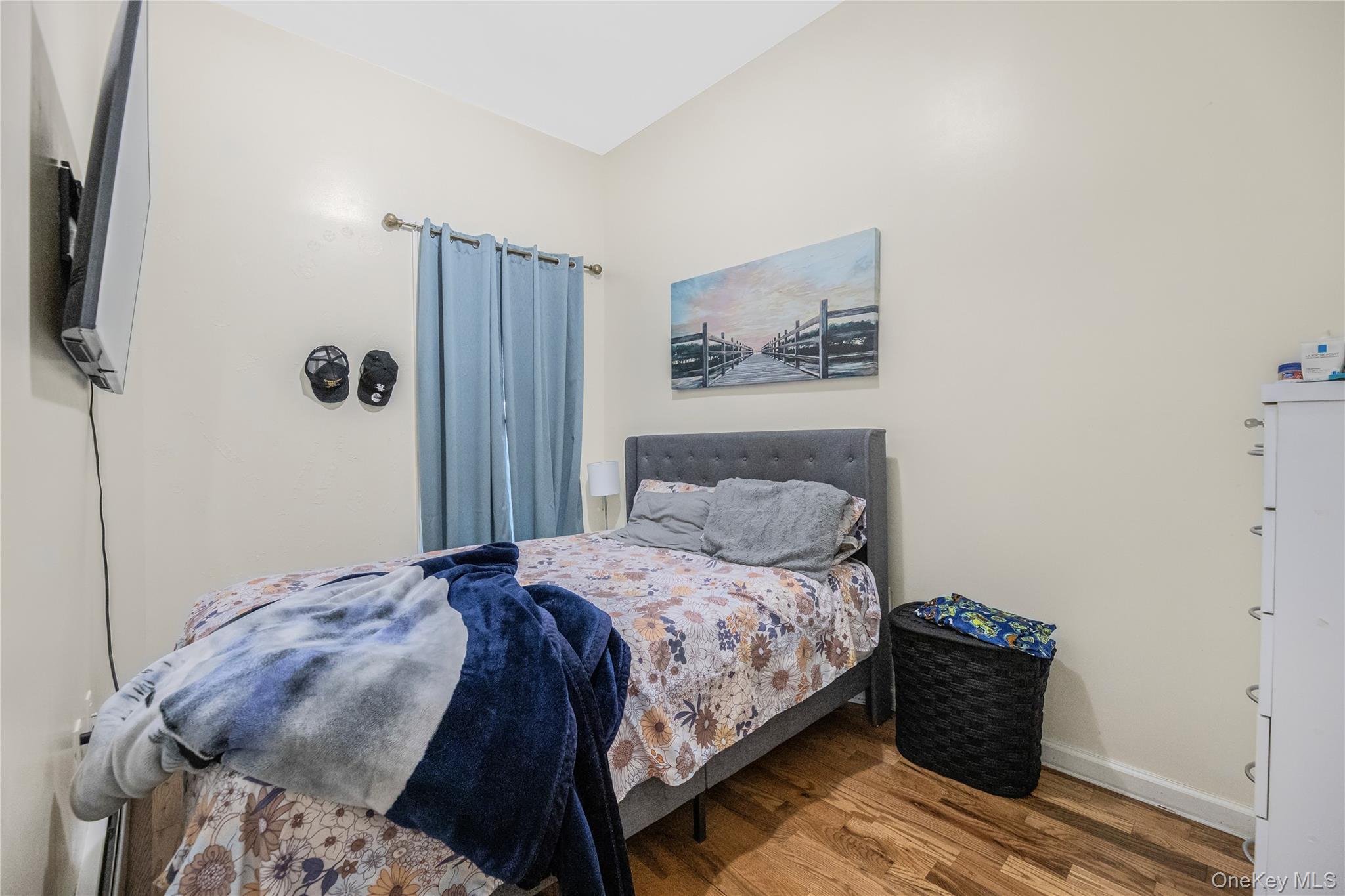 621 Faile Street Bronx, NY 10474 - Photo 14 of 32 a bedroom with a bed and wooden floor