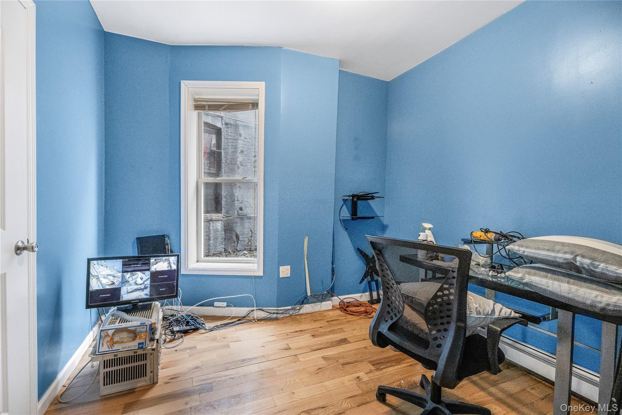 621 Faile Street Bronx, NY 10474 - Photo 16 of 32 a workspace with furniture and a dresser