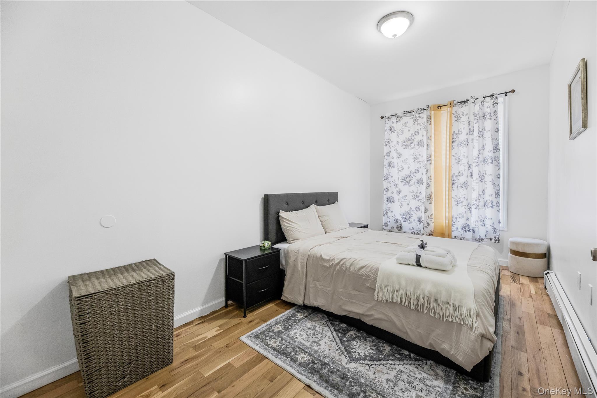 621 Faile Street Bronx, NY 10474 - Photo 17 of 32 a bedroom with a bed and a chair