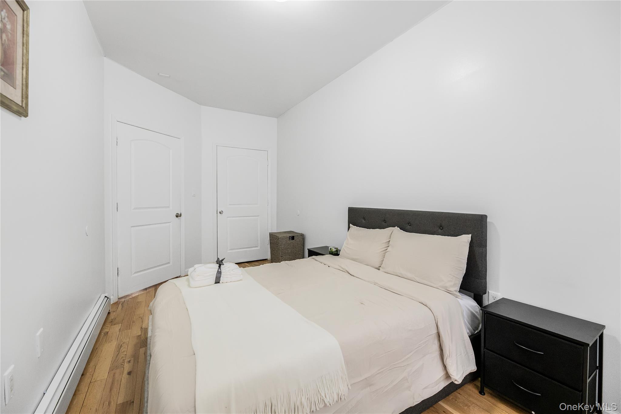 621 Faile Street Bronx, NY 10474 - Photo 18 of 32 a bedroom with a bed and a night stand