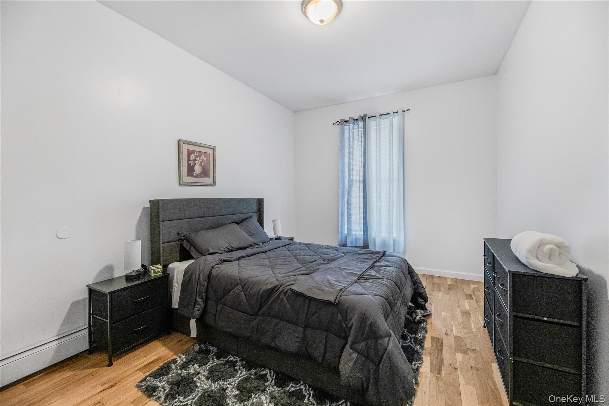 621 Faile Street Bronx, NY 10474 - Photo 19 of 32 a bed sitting in a bedroom next to a window