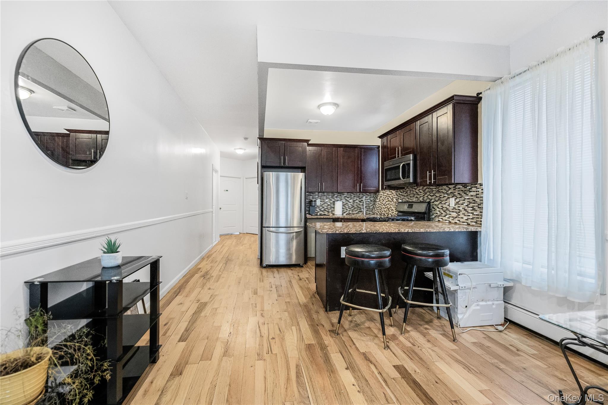 621 Faile Street Bronx, NY 10474 - Photo 23 of 32 a kitchen with a sink cabinets and window