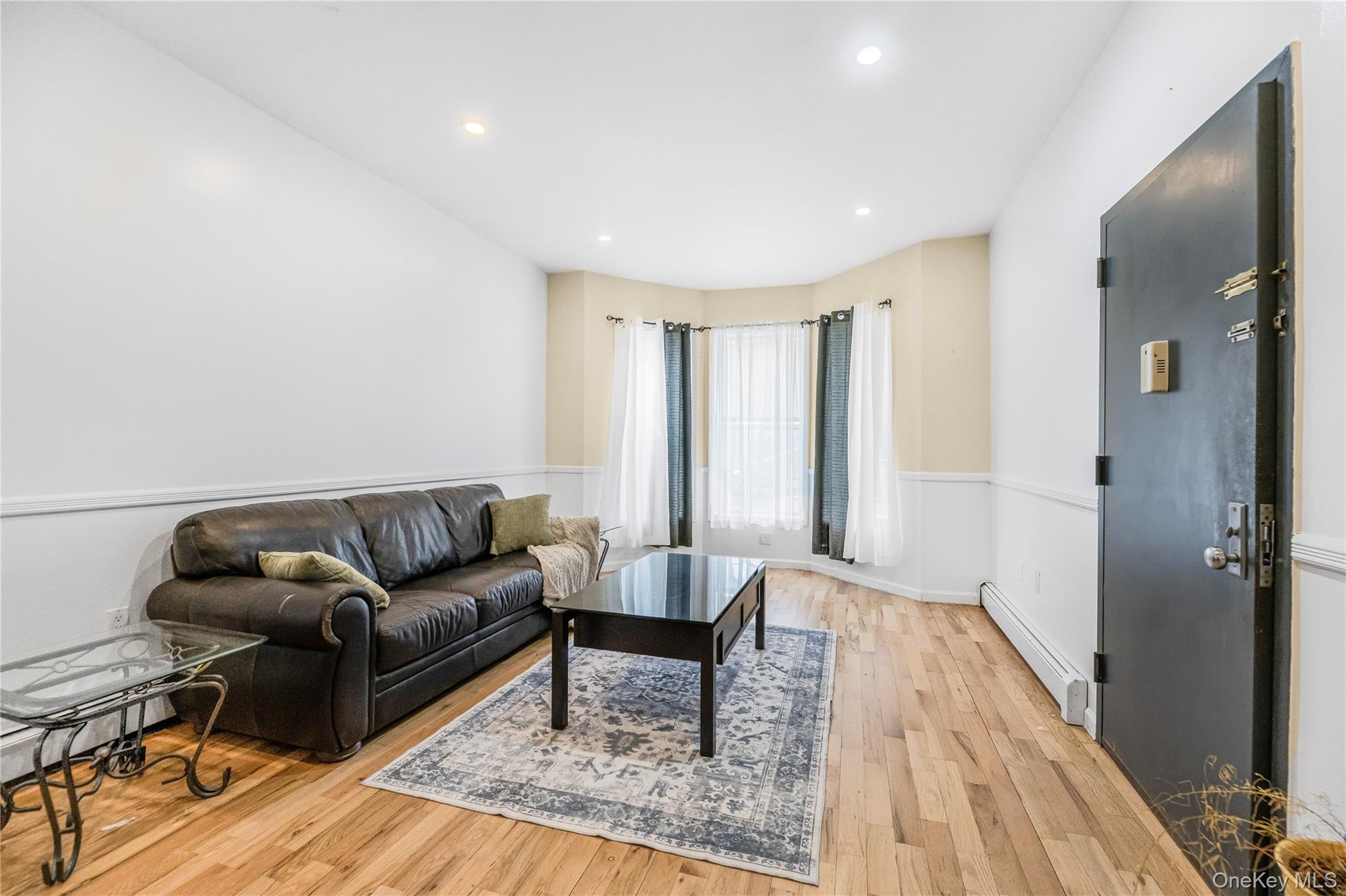 621 Faile Street Bronx, NY 10474 - Photo 24 of 32 a living room with furniture and a wooden floor