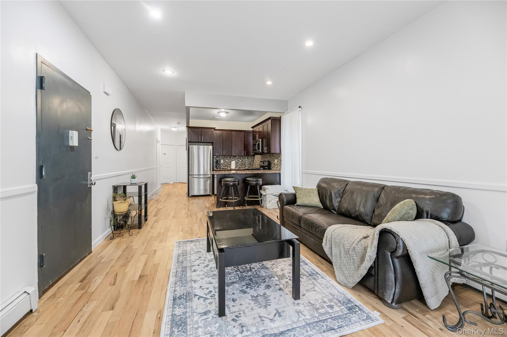 621 Faile Street Bronx, NY 10474 - Photo 25 of 32 a living room with furniture and a wooden floor