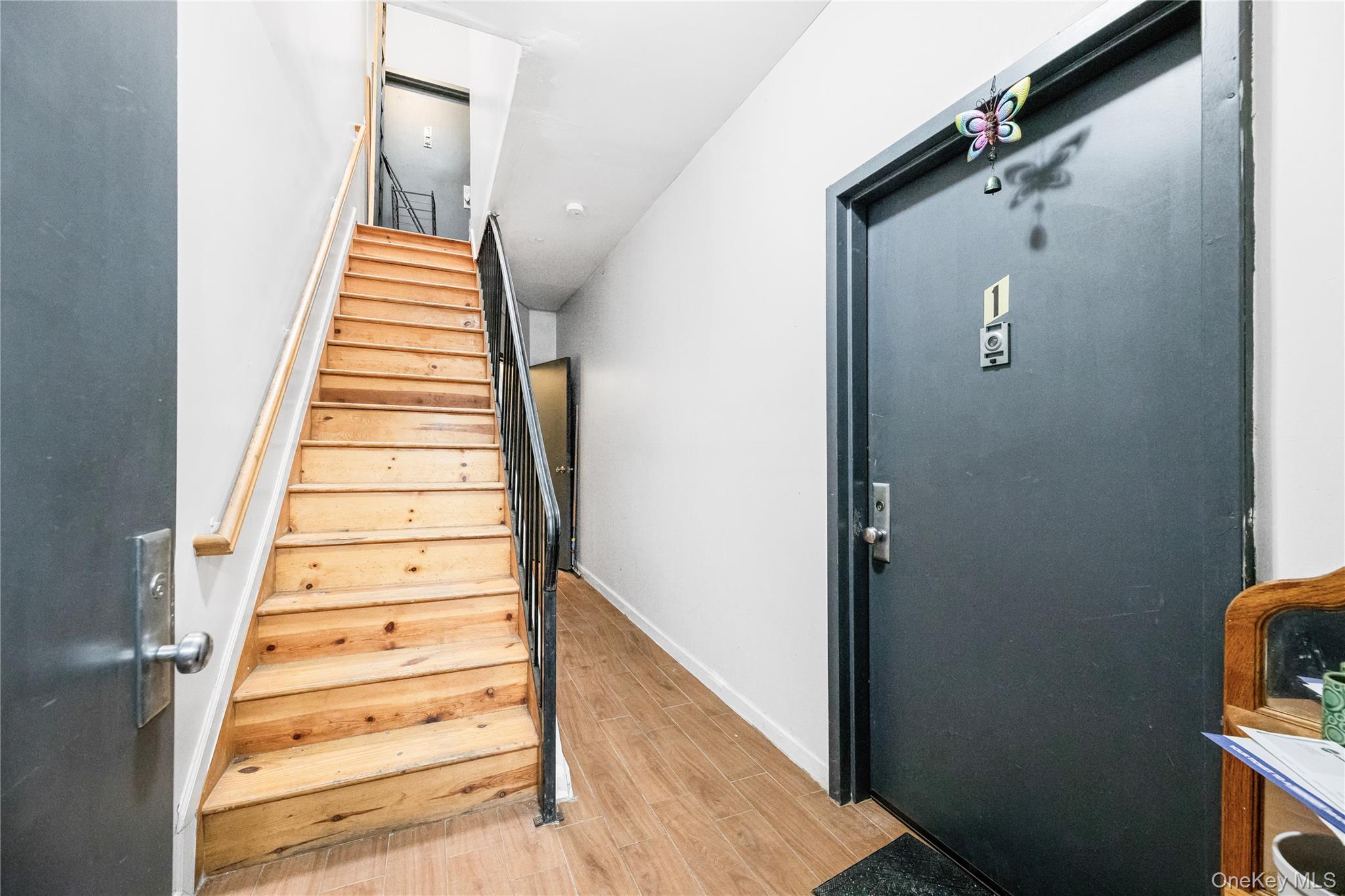 621 Faile Street Bronx, NY 10474 - Photo 5 of 32 a view of a hallway with staircase and white walls
