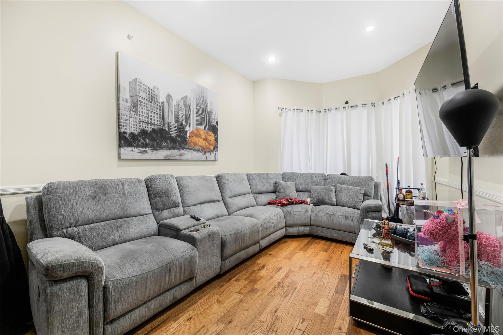 621 Faile Street Bronx, NY 10474 - Photo 6 of 32 a living room with furniture and a flat screen tv