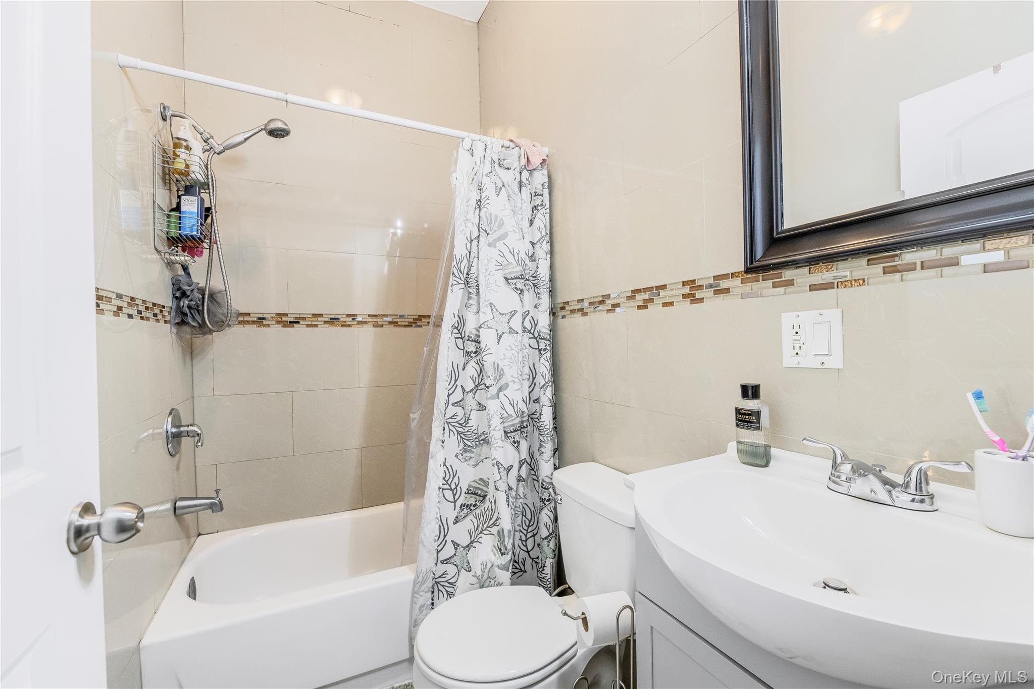 621 Faile Street Bronx, NY 10474 - Photo 9 of 32 a bathroom with a sink toilet and shower