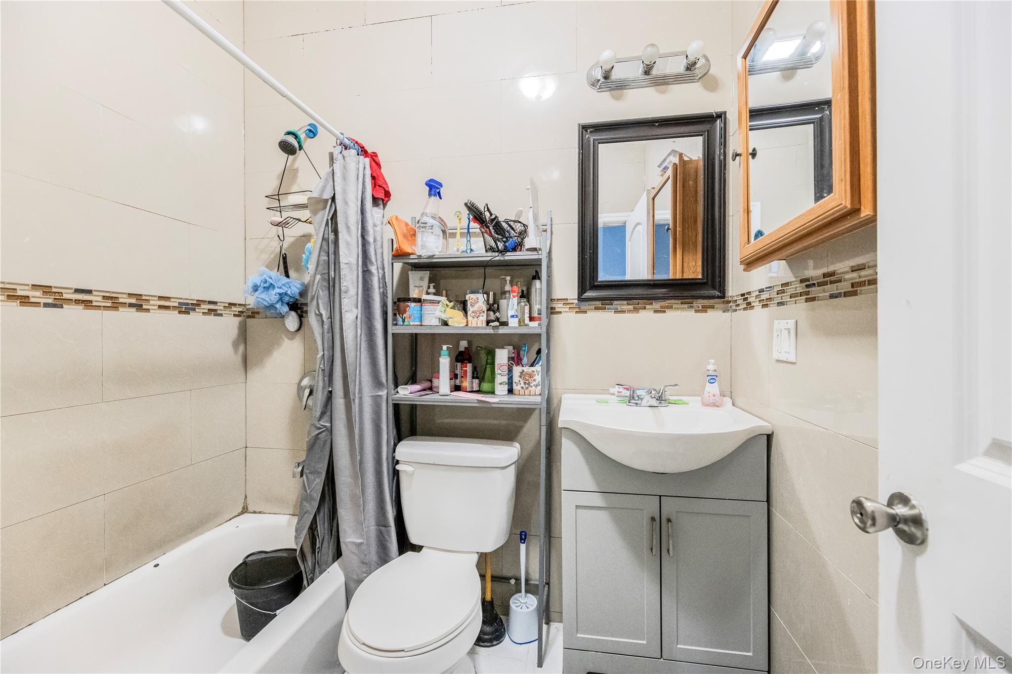 621 Faile Street Bronx, NY 10474 - Photo 10 of 32 a bathroom with a sink toilet and shower