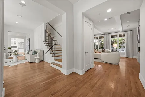 a view of a living room and a wooden floor