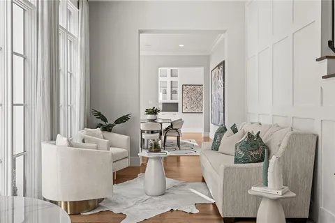 a living room with furniture and a potted plant